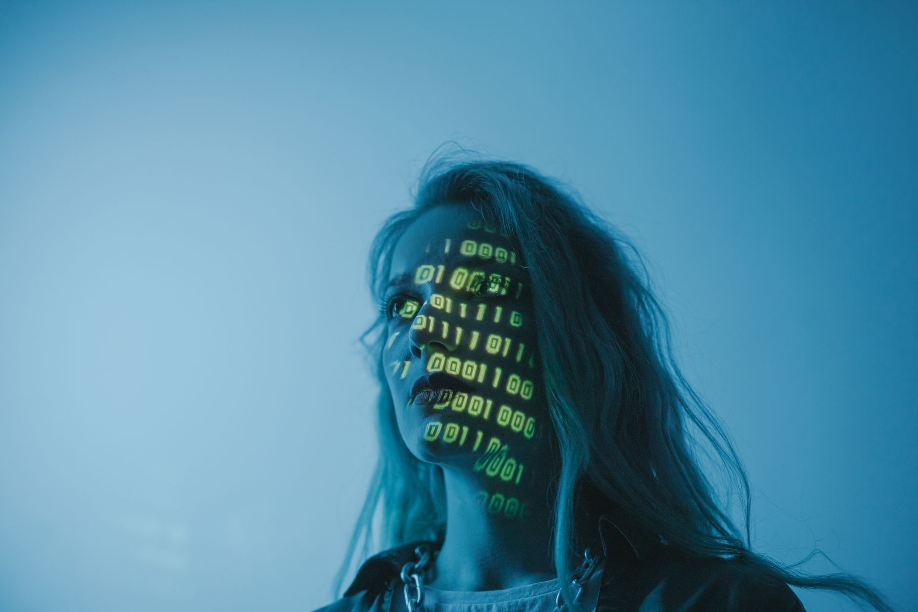 A person deeply focused on learning AI skills on a futuristic laptop, surrounded by lines of code and data visualizations